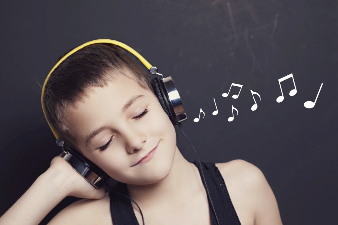 Child Listening to Music in Headphones