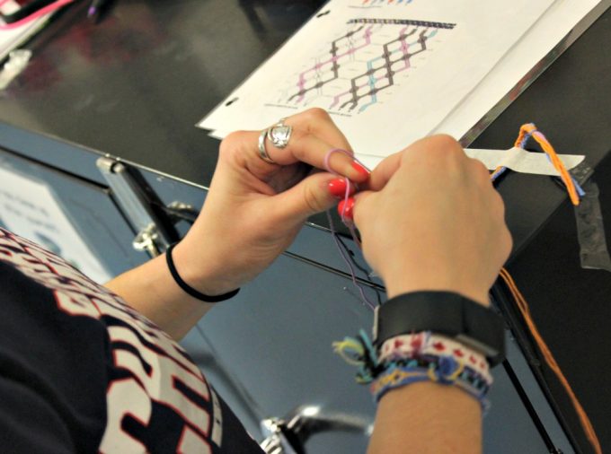 Kat, Residential Counselor, making friendship bracelets with patients